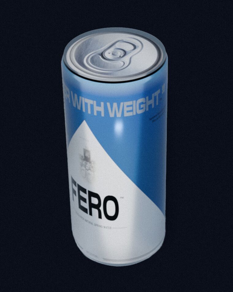 A FERO aluminum can, white and blue, marked Water With Weight, lit against a dark ground